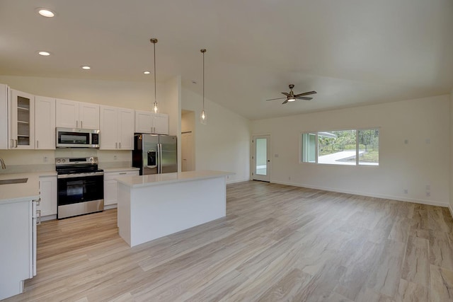 16-1653 34th Ave, Keaau, HI 96760 - kitchen featuring stainless steel appliances, a kitchen island, light countertops, light wood-style floors, and recessed lighting
