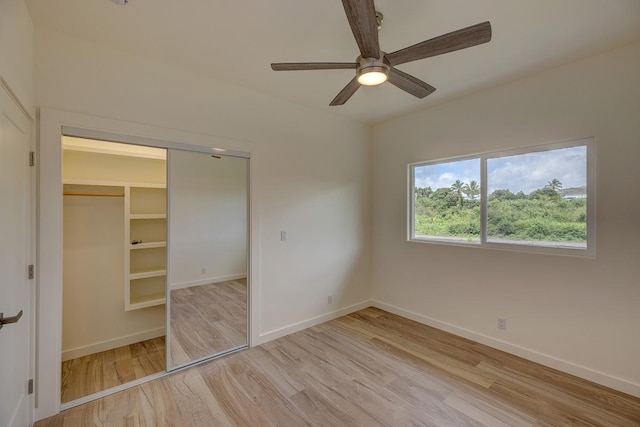 16-1653 34th Ave, Keaau, HI 96760 - unfurnished bedroom featuring light wood-style flooring, a closet, and ceiling fan