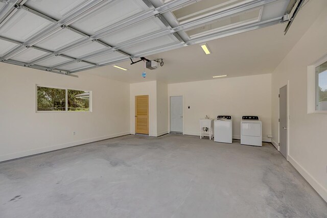 16-1653 34th Ave, Keaau, HI 96760 - garage featuring washing machine and clothes dryer and a garage door opener