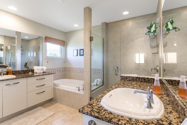78-6833 Alii Dr Unit C5, Kailua-Kona, HI 96740 - full bath with tile patterned floors, vanity, a stall shower, and a bath