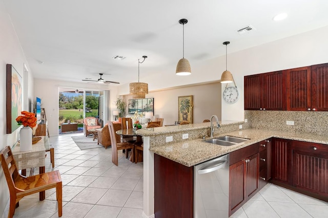 69-200 Pohakulana Pl Unit E2, Waikoloa, HI 96738 - kitchen featuring dishwasher, reddish brown cabinets, light tile patterned floors, decorative light fixtures, and ceiling fan