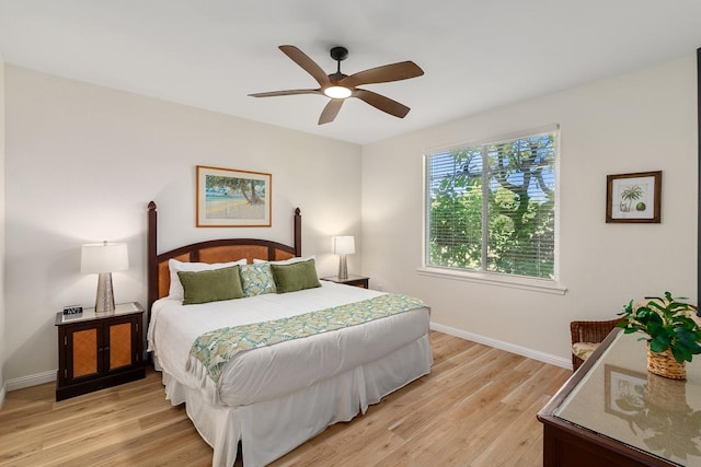 69-200 Pohakulana Pl Unit E2, Waikoloa, HI 96738 - bedroom with light wood-style floors and a ceiling fan