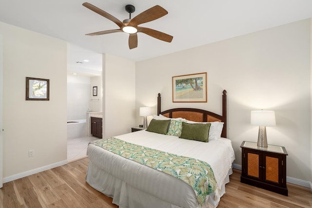 69-200 Pohakulana Pl Unit E2, Waikoloa, HI 96738 - bedroom with light wood finished floors, connected bathroom, recessed lighting, and a ceiling fan
