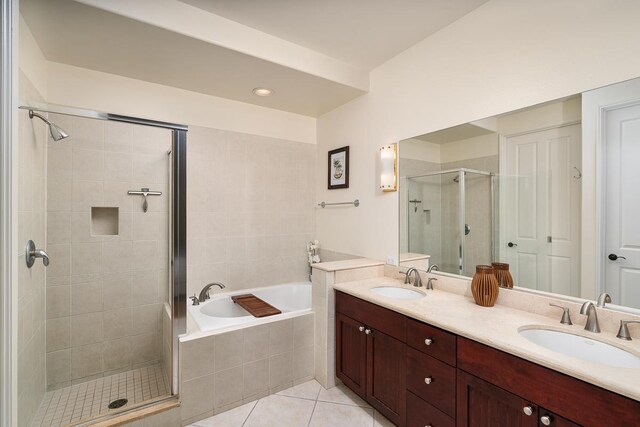 69-200 Pohakulana Pl Unit E2, Waikoloa, HI 96738 - full bath featuring a stall shower, a bath, double vanity, and tile patterned flooring