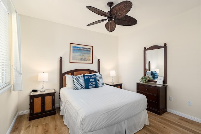 69-200 Pohakulana Pl Unit E2, Waikoloa, HI 96738 - bedroom with light wood-type flooring and a ceiling fan