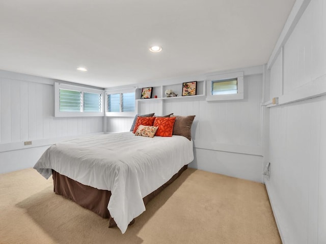 1668 Kilauea Ave, Hilo, HI 96720 - carpeted bedroom featuring multiple windows, a decorative wall, and recessed lighting