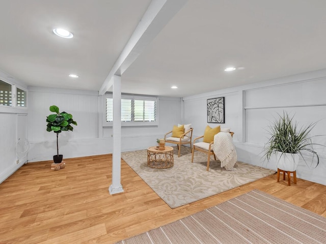 1668 Kilauea Ave, Hilo, HI 96720 - living area with light wood-style floors, a decorative wall, and recessed lighting