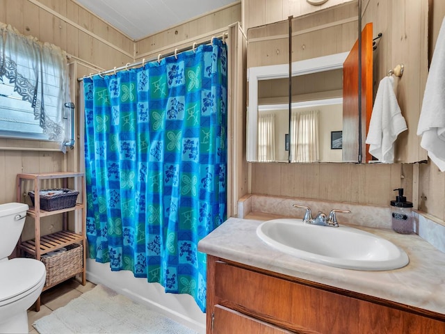 1668 Kilauea Ave, Hilo, HI 96720 - bathroom featuring vanity, plenty of natural light, shower / bath combo, tile patterned flooring, and wood walls