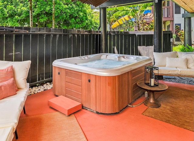 3920 Wyllie Rd Unit 10A, Princeville, HI 96722 - view of patio featuring a hot tub and outdoor lounge area