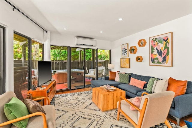 3920 Wyllie Rd Unit 10A, Princeville, HI 96722 - living room featuring a wall mounted air conditioner and recessed lighting
