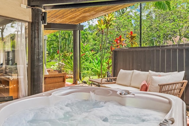 3920 Wyllie Rd Unit 10A, Princeville, HI 96722 - view of patio / terrace with a hot tub