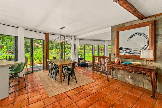 3920 Wyllie Rd Unit 10A, Princeville, HI 96722 - sunroom featuring tile patterned floors, plenty of natural light, and beamed ceiling
