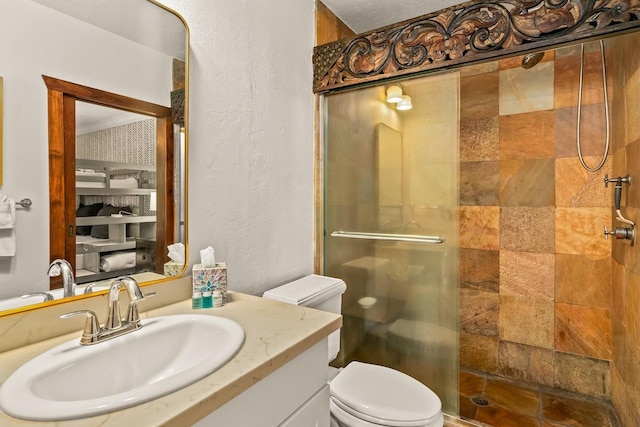 3920 Wyllie Rd Unit 10A, Princeville, HI 96722 - bathroom featuring a shower stall, vanity, and a textured wall