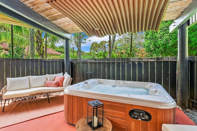 3920 Wyllie Rd Unit 10A, Princeville, HI 96722 - view of patio featuring a hot tub