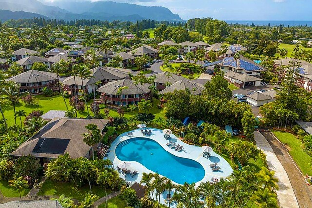 3920 Wyllie Rd Unit 10A, Princeville, HI 96722 - aerial view of residential area featuring a pool area and a mountainous background