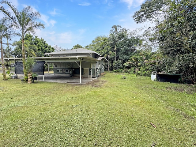 17-312 Volcano Rd, Kurtistown, HI 96760 - view of green lawn featuring a patio area