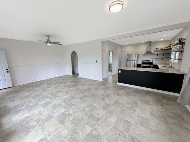 17-312 Volcano Rd, Kurtistown, HI 96760 - kitchen featuring wall chimney range hood, appliances with stainless steel finishes, open shelves, light countertops, and ceiling fan