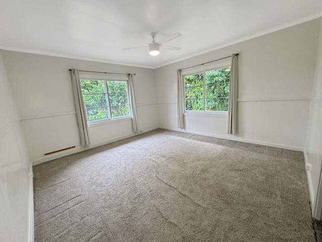 17-312 Volcano Rd, Kurtistown, HI 96760 - spare room featuring healthy amount of natural light, carpet, ornamental molding, and ceiling fan
