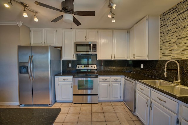 68-1768 Niu Haohao Pl, Waikoloa, HI 96738 - kitchen with track lighting, stainless steel appliances, white cabinetry, and light tile patterned floors