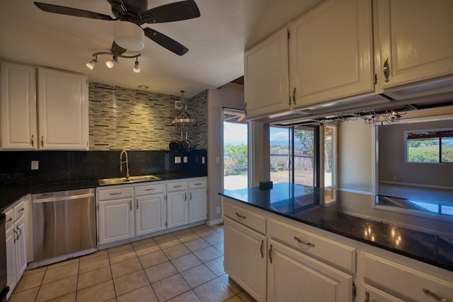 68-1768 Niu Haohao Pl, Waikoloa, HI 96738 - kitchen featuring dark countertops, tasteful backsplash, stainless steel dishwasher, and white cabinets