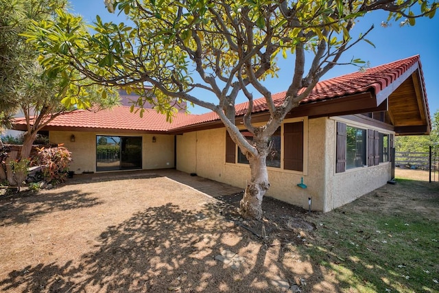 68-1768 Niu Haohao Pl, Waikoloa, HI 96738 - back of house featuring a tiled roof and stucco siding