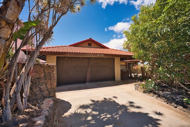 68-1768 Niu Haohao Pl, Waikoloa, HI 96738 - view of front of property with driveway, a garage, a tile roof, and stucco siding