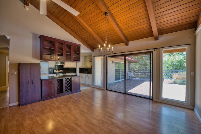68-1768 Niu Haohao Pl, Waikoloa, HI 96738 - kitchen featuring dark countertops, a peninsula, a wood ceiling with exposed beams, light wood finished floors, and a chandelier
