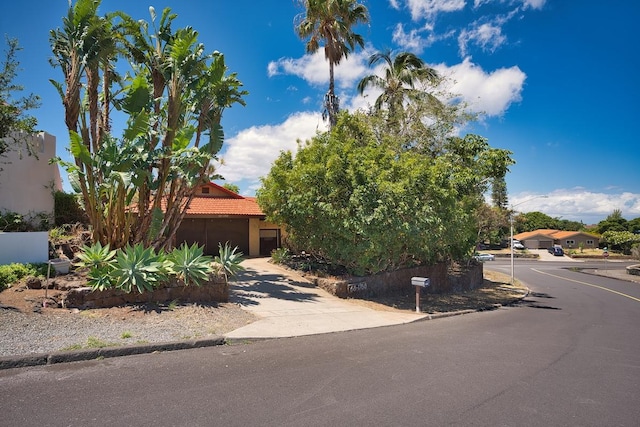 68-1768 Niu Haohao Pl, Waikoloa, HI 96738 - obstructed view of property with a tile roof, driveway, and stucco siding