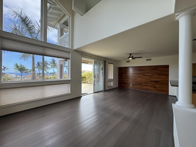 75-6060 Kuakini Hwy Unit E4, Kailua-Kona, HI 96740 - unfurnished living room with decorative columns, ceiling fan, and dark wood finished floors