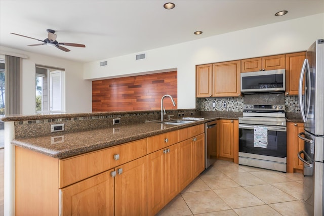 75-6060 Kuakini Hwy Unit E4, Kailua-Kona, HI 96740 - kitchen with appliances with stainless steel finishes, backsplash, ceiling fan, dark stone counters, and recessed lighting
