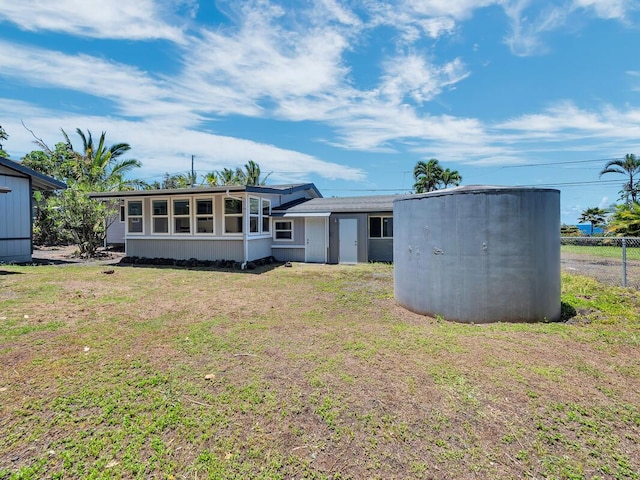 15-974 Paradise Ala Kai Dr, Keaau, HI 96749 - rear view of property featuring a lawn, a sunroom, and an outbuilding