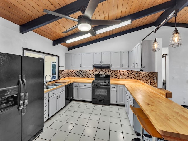 15-974 Paradise Ala Kai Dr, Keaau, HI 96749 - kitchen with black appliances, butcher block countertops, wooden ceiling, light tile patterned flooring, and tasteful backsplash