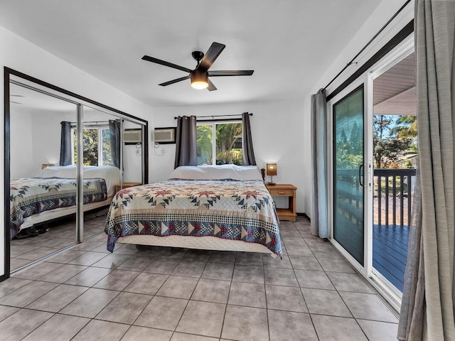 15-974 Paradise Ala Kai Dr, Keaau, HI 96749 - tiled bedroom featuring access to exterior, a ceiling fan, and an AC wall unit