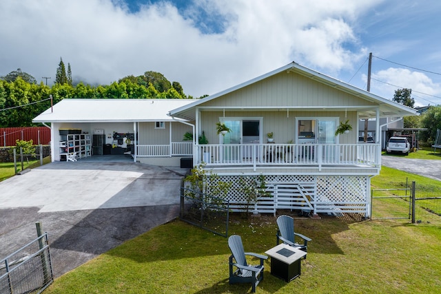 64-5246 Puu Nani Dr, Kamuela, HI 96743 - view of front of home featuring driveway, covered porch, a gate, an outdoor fire pit, and a carport