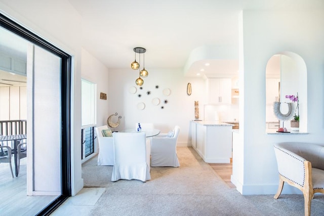 1565 Pee Rd Unit 122, Koloa, HI 96756 - dining space with light colored carpet and baseboards