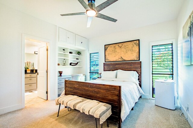 1565 Pee Rd Unit 122, Koloa, HI 96756 - bedroom featuring light carpet, multiple windows, ensuite bath, and ceiling fan