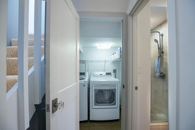 1565 Pee Rd Unit 122, Koloa, HI 96756 - washroom featuring separate washer and dryer and tile patterned flooring