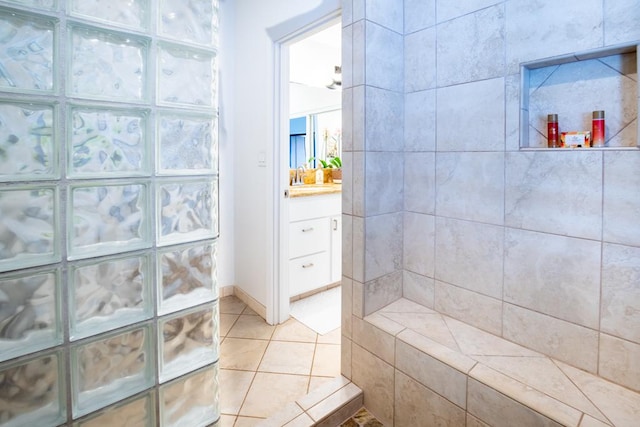 1565 Pee Rd Unit 122, Koloa, HI 96756 - bathroom featuring vanity, tile patterned floors, and tiled shower