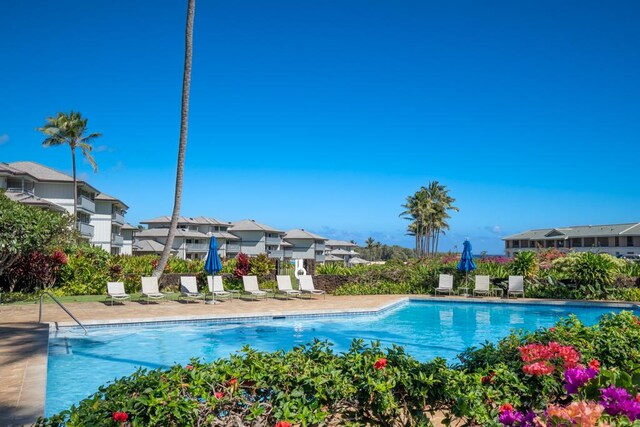 1565 Pee Rd Unit 122, Koloa, HI 96756 - community pool featuring a residential view