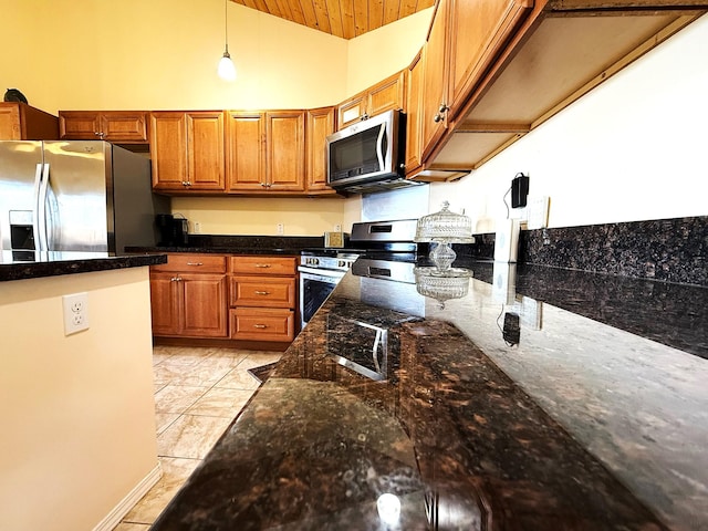 16-2110 Pearl Dr, Pahoa, HI 96778 - kitchen with stainless steel appliances, brown cabinetry, pendant lighting, dark stone countertops, and wooden ceiling