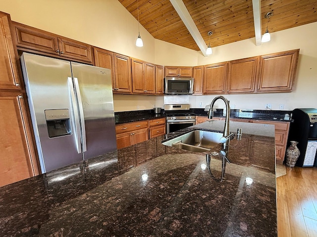 16-2110 Pearl Dr, Pahoa, HI 96778 - kitchen with stainless steel appliances, wood ceiling, brown cabinets, hanging light fixtures, and dark stone counters