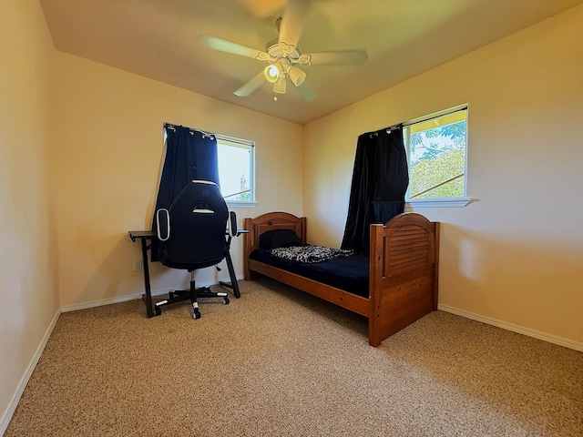 16-2110 Pearl Dr, Pahoa, HI 96778 - bedroom featuring multiple windows, light colored carpet, and a ceiling fan