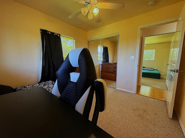 16-2110 Pearl Dr, Pahoa, HI 96778 - bedroom featuring light carpet, a closet, multiple windows, and a ceiling fan