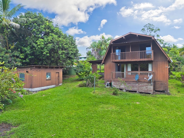 16-1331 Opeapea Rd, Mountain View, HI 96760 - rear view of property featuring a yard, a balcony, and a storage unit