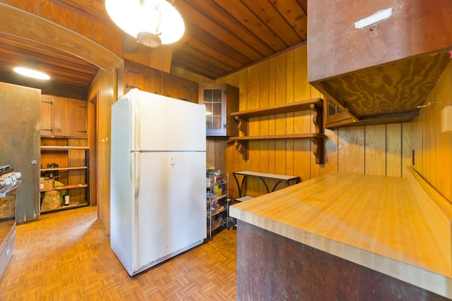 16-1331 Opeapea Rd, Mountain View, HI 96760 - kitchen with freestanding refrigerator, wood walls, wood ceiling, and open shelves
