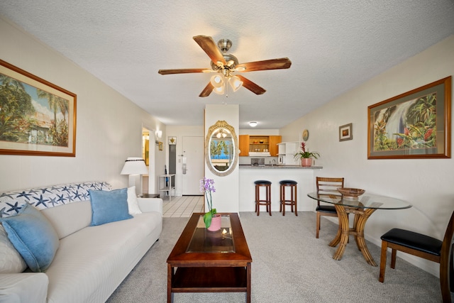 525 Aleka Lp Unit F15, Kapaa, HI 96746 - carpeted living area with ceiling fan and a textured ceiling