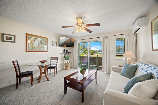 525 Aleka Lp Unit F15, Kapaa, HI 96746 - living room featuring an AC wall unit, a ceiling fan, carpet flooring, and a textured ceiling