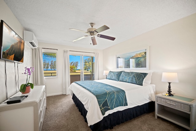525 Aleka Lp Unit F15, Kapaa, HI 96746 - carpeted bedroom featuring an AC wall unit, a ceiling fan, and a textured ceiling