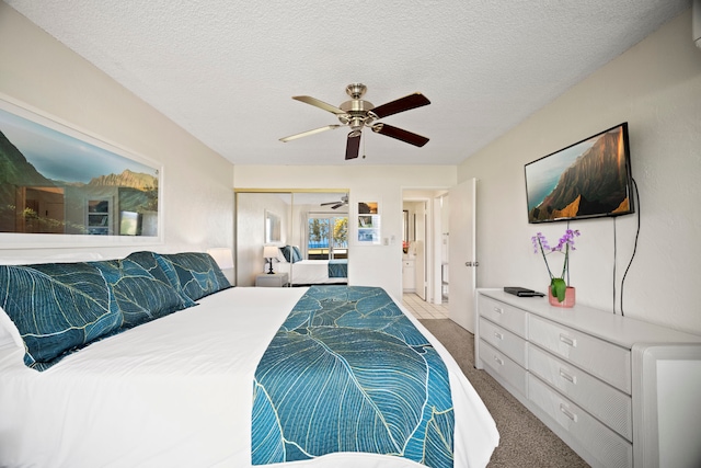 525 Aleka Lp Unit F15, Kapaa, HI 96746 - carpeted bedroom with a closet, a ceiling fan, and a textured ceiling