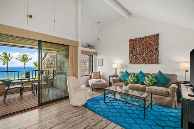 3700 Kamehameha Rd Unit H5, Princeville, HI 96722 - living area featuring wood finished floors, beamed ceiling, a water view, and high vaulted ceiling